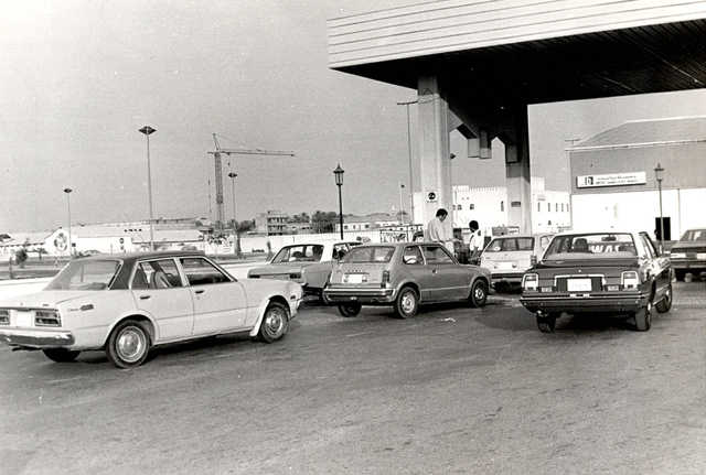 <p>1979 Cars lined up for petrol at a station in Manama where both grades of fuel, Mumtaz and Jayyed are available.</p>